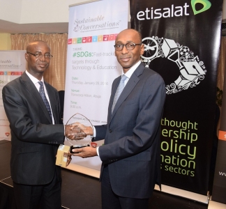 (R-L) Vice President, Regulatory & Corporate Affairs, Etisalat Nigeria, Ibrahim Dikko presenting a plaque to the representative of the Honourable Minister for Science and Deputy Director, Research and Statistics, Ministry of Science and Tech, Mr. Anyanwu Anselem at the Sustainable Conversations thought leadership series sponsored by Etisalat Nigeria in Abuja on Thursday.