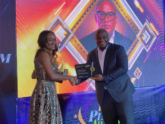 L-R- Chief Strategy Officer, Interswitch Group, Ndifreke Nkose (representing the Founder/Group Managing Director, Interswitch Group, Mitchell Elegbe), receiving the Fintech Ecosystem Leadership Award from Wole Oyeniran, Partner, Enterprise Technology & Performance Consulting (West Africa), Deloitte, at the Platinum Fintech Awards organised by the Fintech Association of Nigeria, in Lagos last Saturday.