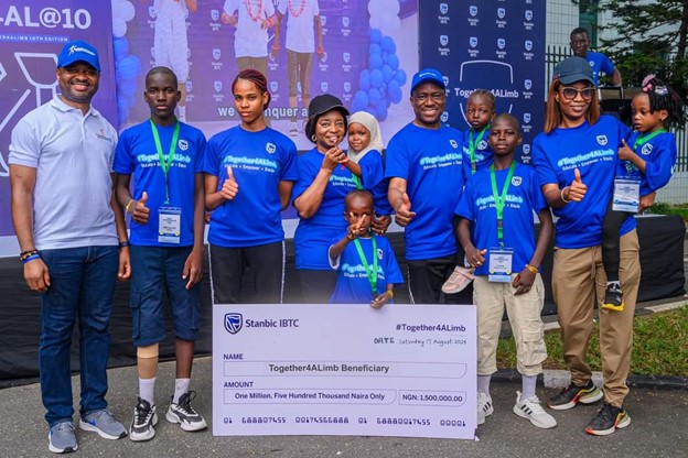 L-R: Wole Adeniyi, Chief Executive, Stanbic IBTC Bank; Dr Ibijoke Sanwo-Olu, First Lady of Lagos State; Dr Demola Sogunle, Chief Executive, Stanbic IBTC Holdings and Together4ALimb beneficiaries  during the 10th edition of Together4ALimb charity walk, Stanbic IBTC Holdings' Corporate Social Investment (CSI) initiative, held at Walter Carrington Crescent, Victoria Island, Lagos. 
